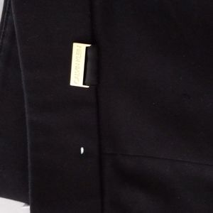 Black Calvin kline dress pants with slim ankle fit with a slit at open of pant